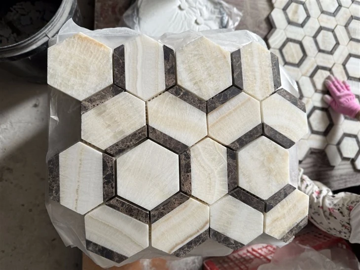 Close-up of one polished 10 mm Vanilla Onyx and Emperador Dark Marble mixed mosaic sheet showing pale onyx fields and dark brown marble accents.